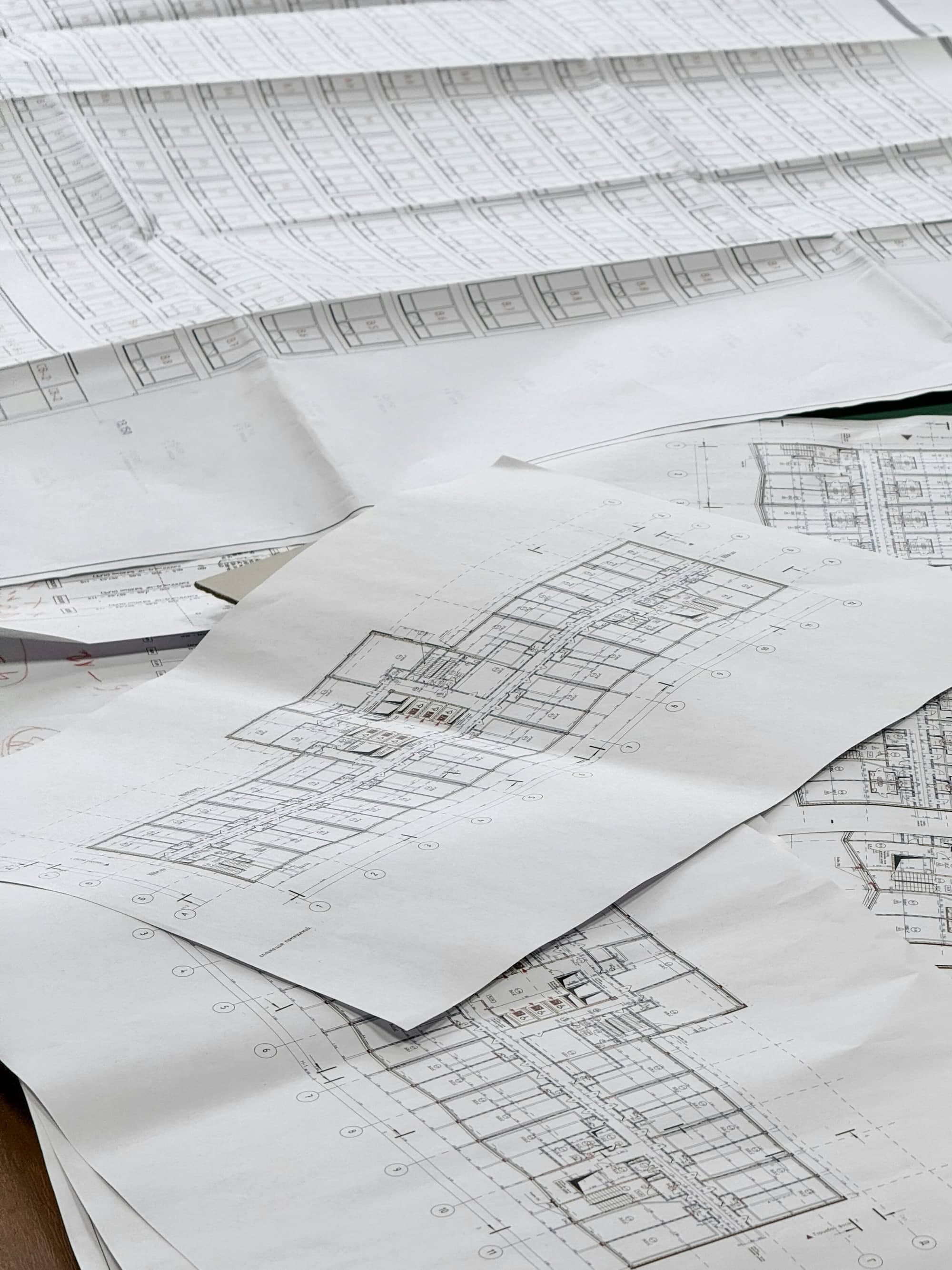 Old blueprint plans being redrawn into CAD and Revit by ArchPermits.