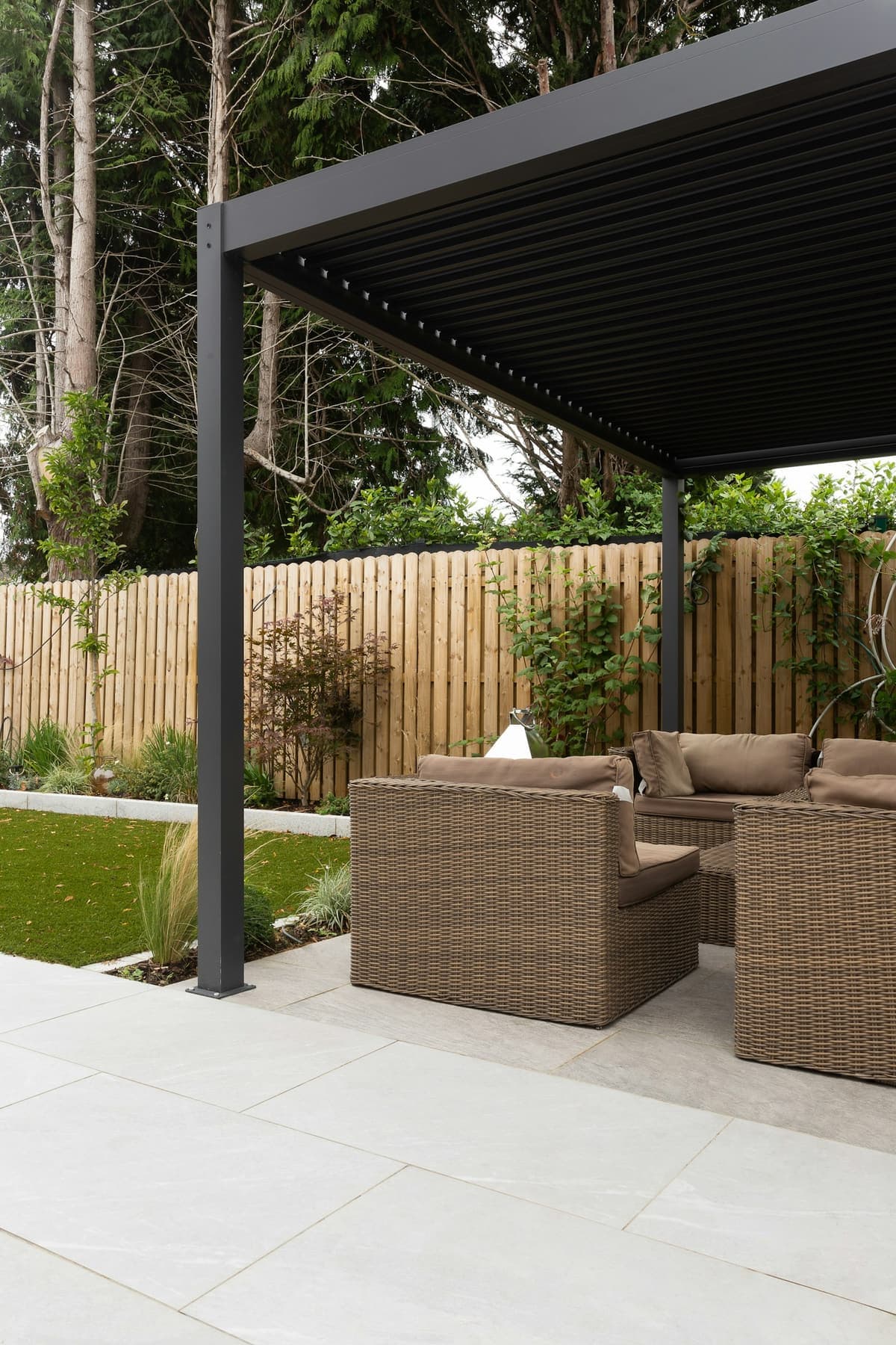 A refined pergola-covered patio with built-in outdoor seating, representative of ArchPermits' outdoor living permit drawings.
